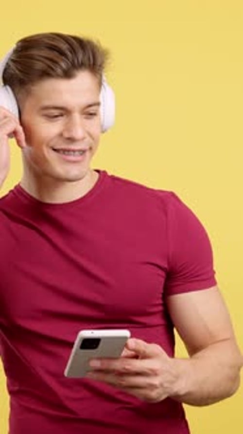 Young Adult Listening to Music With Smartphone