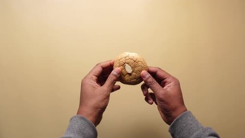 Top View of Hand Cracking Sweet Cookies
