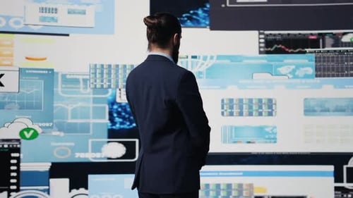 Man Presenting Data Analysis in Futuristic Environment