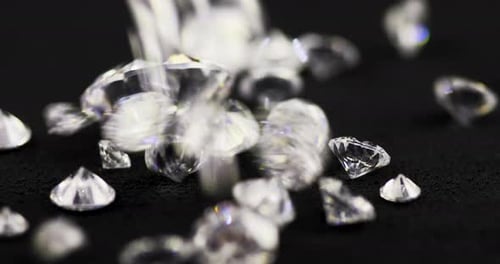 Diamonds Falling onto Black Surface
