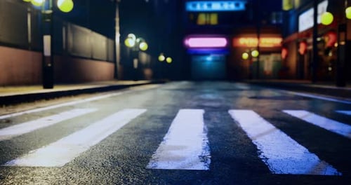 Quiet Urban Street Illuminated By Colorful Lights at Night