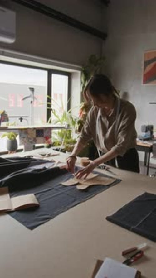 Woman Designing Clothing Patterns at Studio