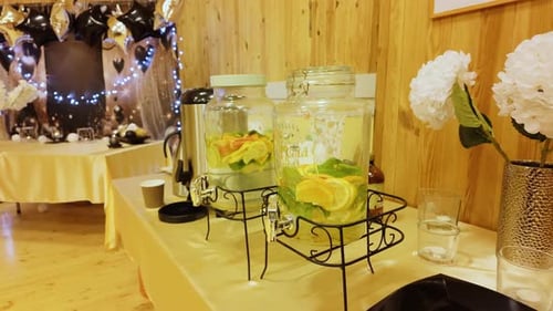 Infused water and party decorations indoors close up