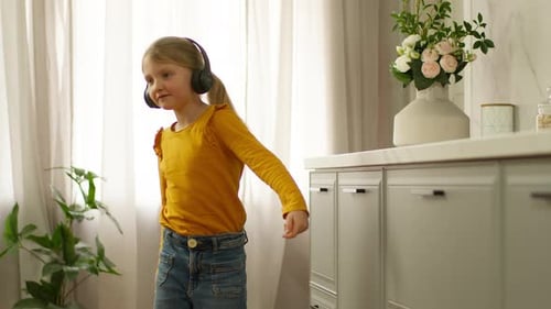 Little European Girl in Earphones Headphone Listening Music Gadget Tech Kid Device Mp3 Songs