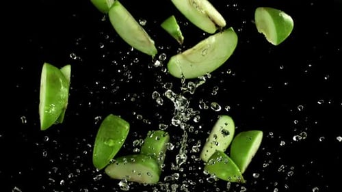Pieces of Green Apples Fly Up and Fall Down Filmed on a Highspeed Camera at 1000 Fps