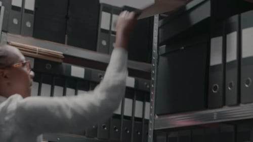 Police Inspector Examining Forensic Evidence in Office