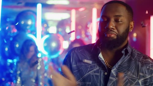 Closeup African Guy Moving Shoulders at Party Ni Night Club. Portrait Of