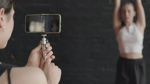 Recording Video of Woman Doing Contemporary Dance in Studio