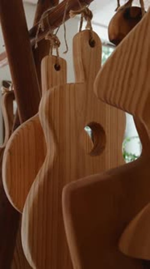 Handcrafted Wooden Cutting Boards Hanging in a Carpenter's Artisan Workshop Display