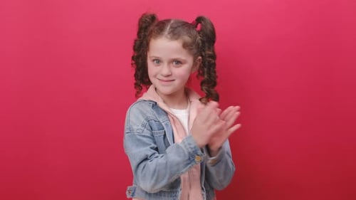 Enthusiastic Girl Claps and Gives Thumbs Up