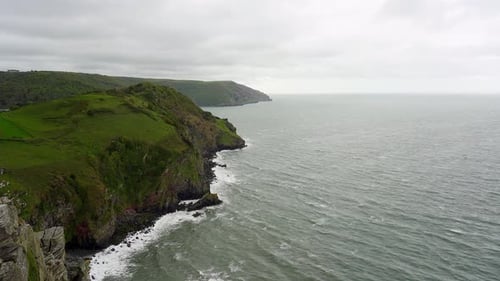 Waves lap the cliffs on the north Devon coast from the Valley of the Rocks in Exmoor National Park n