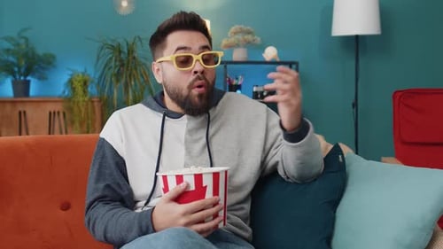 Man With 3D Glasses Watching Movie Eating Popcorn