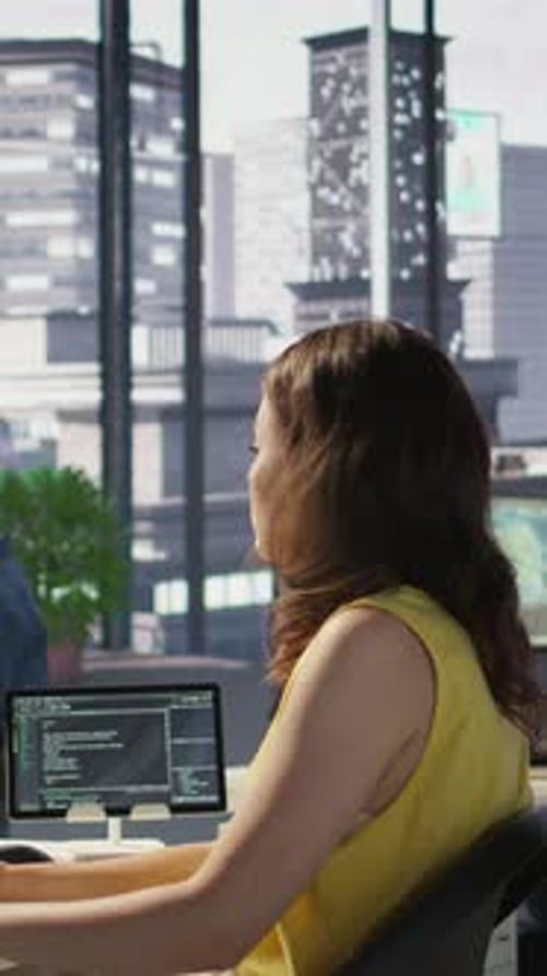Woman Works on Computer in Modern Office