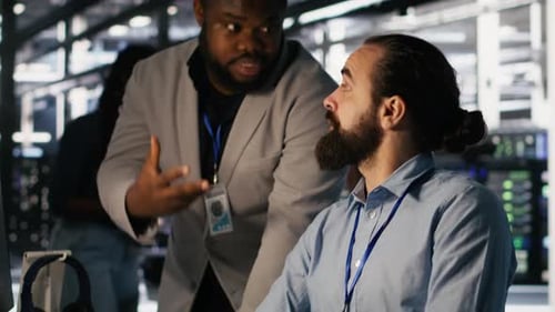 Colleagues Working Together in Data Center Environment