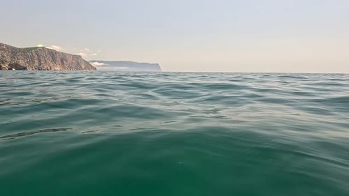 Sea Water Surface Background Low Angle View From Kayak Camera Flies Over the Clear Green Sea Water