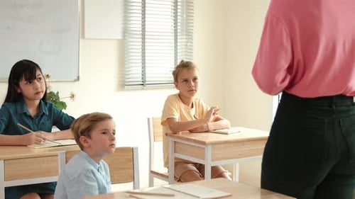 Children Learning in Classroom with Teacher Present
