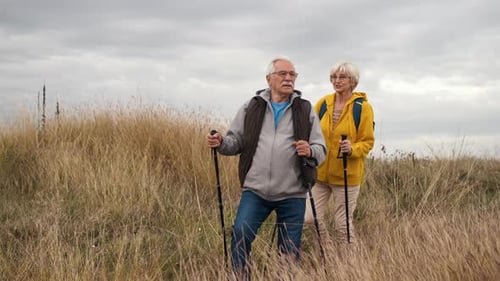 Senior Couple Hiking in Rural Landscape