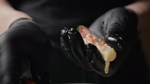 Gloved Hands Expertly Peeling Shrimp for Cooking