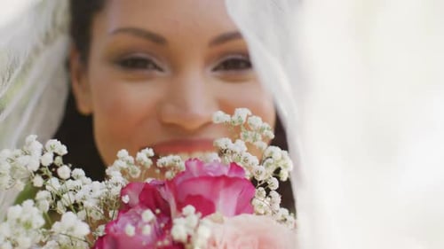 Smiling Bride Holding Flower Bouquet on Wedding Day