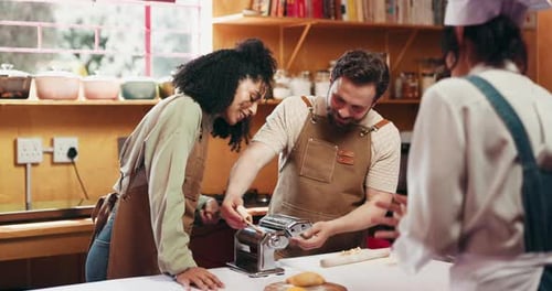 Cooking class, chef and couple with pasta in kitchen for culinary skills