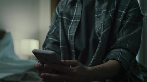 Upset Person On Bed Using Phone