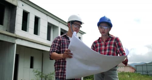 Portrait of young asian man engineer safety equipment at construction site