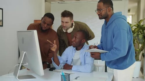Group of Male Developers Discussing Code for Applications