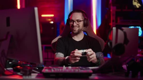 Young Man Playing Video Games at Night