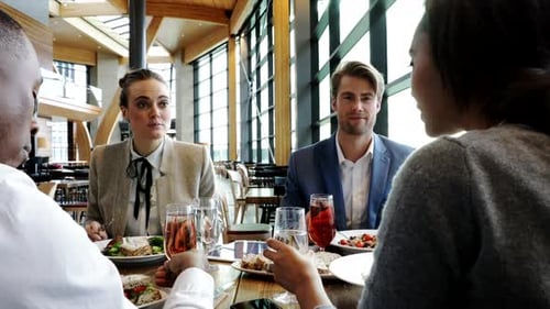 Business People Enjoying Working Lunch In Restaurant