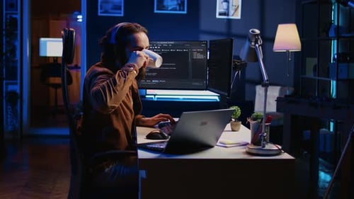 Programmer Does Multitasking Drinks Coffee Listens Music