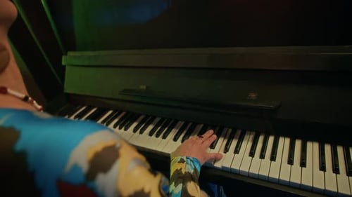 Musician Plays Piano with Vintage Microphone