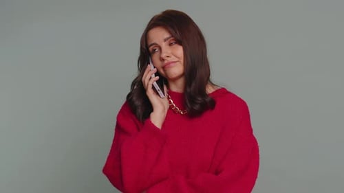 Distressed Woman Talking on Phone Indoors