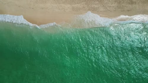 Sea Waves Breaking on Sand Beach