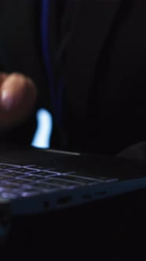 Vertical Video Programmer in Server Hub Checking Recovery Plan on Laptop Close Up