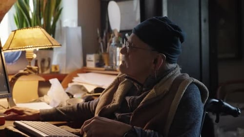 Senior Adult Working at Computer at Home