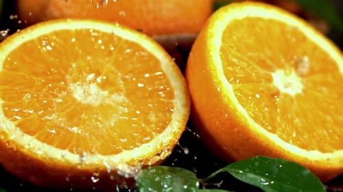 Super Slow Motion Orange Juice Drips on Half an Orange Filmed at 1000 Fps