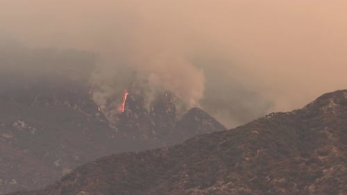 Forest fire burning a mountainside near Los Angeles