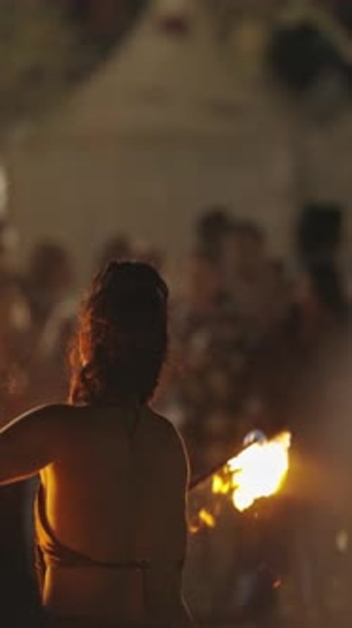 Woman Performs Fire Dancing Show for Crowd at Night