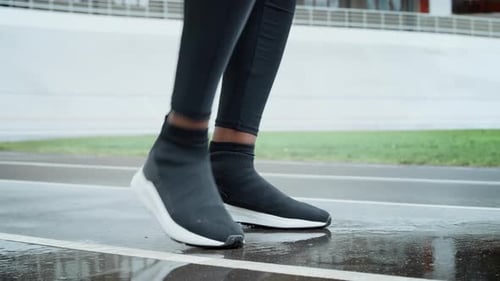 Close Up of Male Athlete Starting to Run on Racetrack. Male Jogger