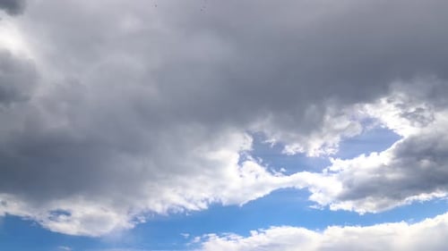 Dramatic Cloudscape with Bright Blue Sky and Puffy Clouds