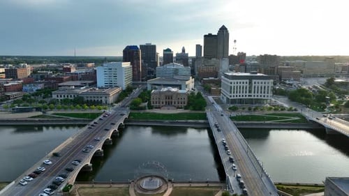 Aerial truck shot of Des Moines, Iowa. Beautiful summer sunset over skyline and Des Moines River.