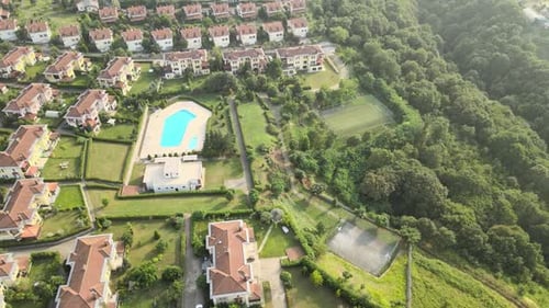 Aerial View of Quiet Suburban Neighborhood Bordering Forest
