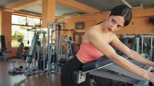 Woman Looking Herself In The Mirror While Training