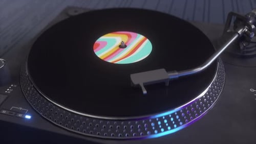 Closeup of a vinyl record slowly rotating on a dark background