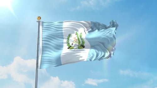 Waving Guatemala Flag in Bright Blue Sky
