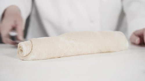 Unbaked Cinnamon Rolls in a Blue Baking Pan