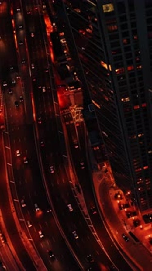 Aerial view of nighttime Chicago streets and skyline from above