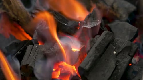 Close up of red hot coals glowed in the stove