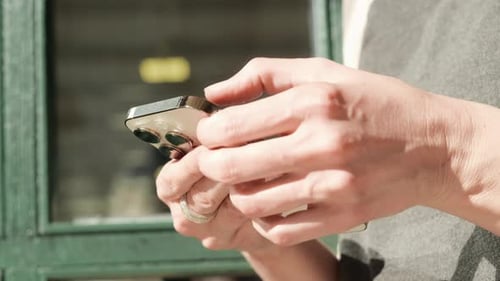 Close up of hands using a phone