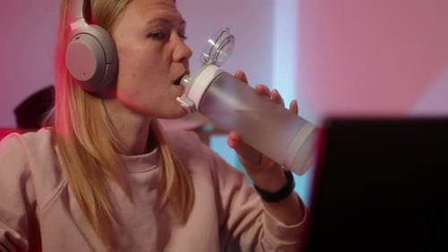 Girl Gamer Drink Water During Online Game